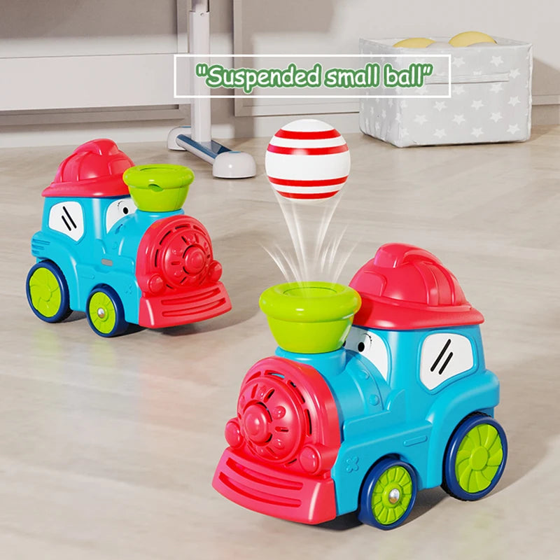 A red and blue electric steam train toy set with magnetic cars and a suspended small ball