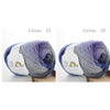 A ball of purple and grey merino wool yarn is shown, ready for knitting or crochet.