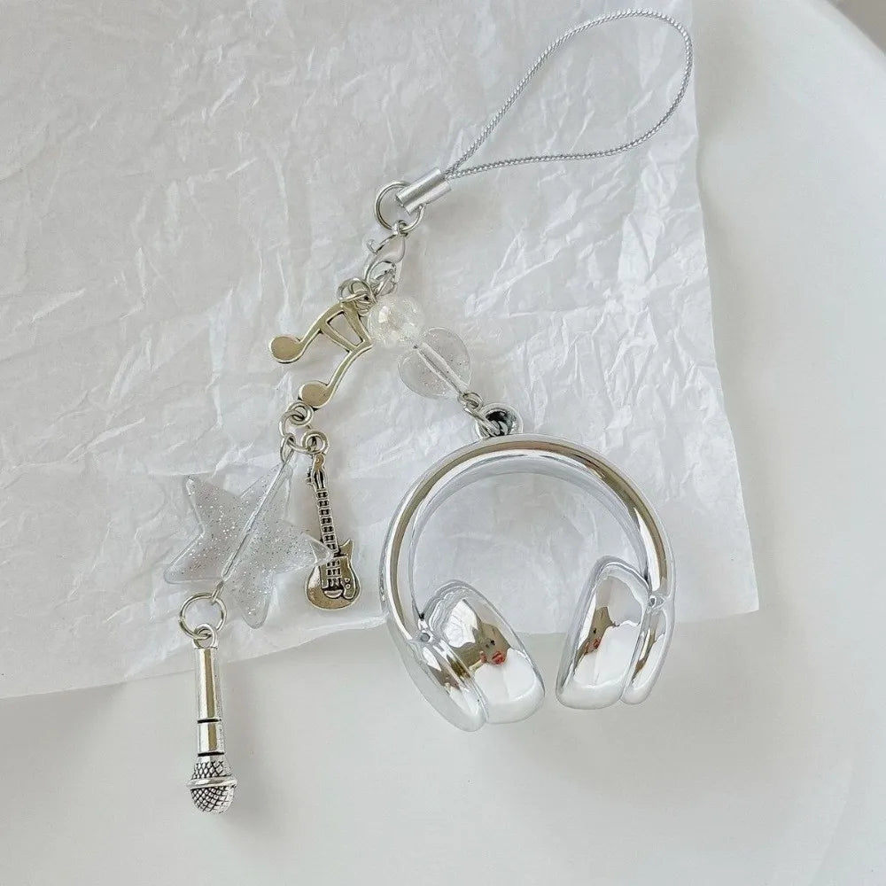 Silver beaded wing cross phone lanyard keychain with a clear ring and dangling charms