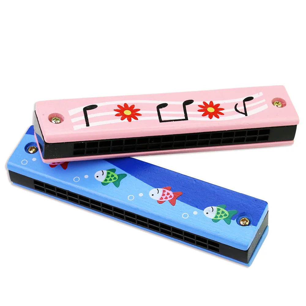 Pink wooden harmonica with a cartoon animal design featuring fish and stars