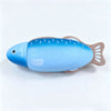 A blue wooden magnetic toy shaped like a fish, used as a cutting tool.