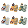 A set of six kids cotton cartoon animal socks with non-slip grips in various colors and designs.