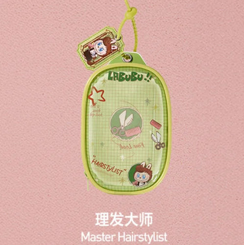 A green pendant keychain featuring a character from the LABUBU series, used as a master hairstylist item.