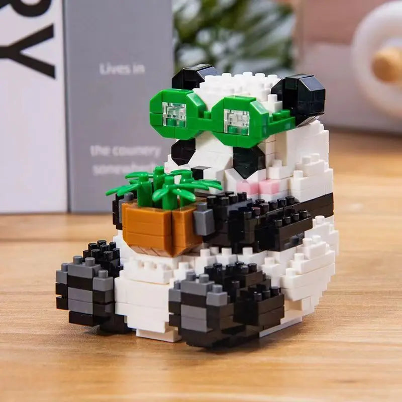 A mini panda building block set featuring black and white pieces with green glasses.