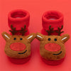 Pair of red baby anti-slip cotton socks with festive Christmas deer designs