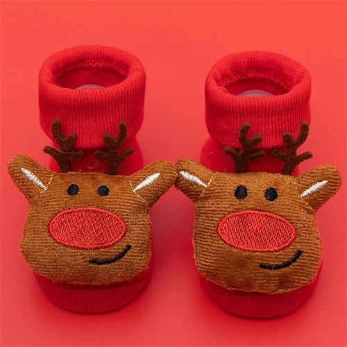 Pair of red baby anti-slip cotton socks with festive Christmas deer designs