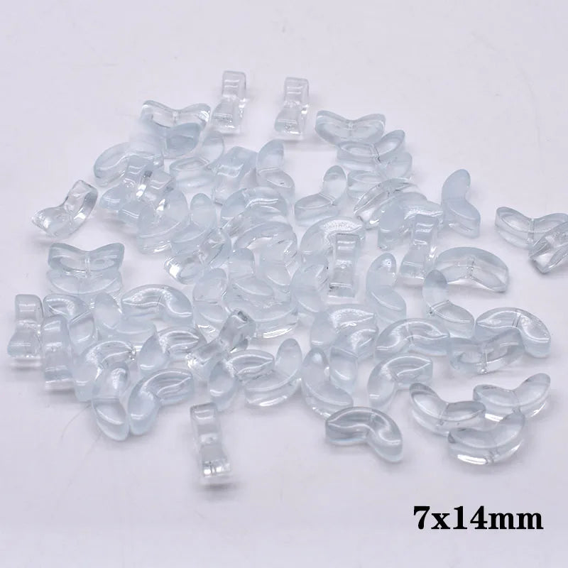 A pile of clear glass beads shaped like tulip flowers, measuring 7x14mm.