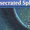 A close-up of a creature with a spiky crown and glowing eyes, likely a card illustration.
