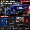 A blue RC container truck model with a trailer and various accessory parts shown in a dark setting.