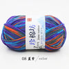 A ball of multi-colored yarn featuring shades of purple, blue, orange, and green, labeled as Jane cotton yarn.