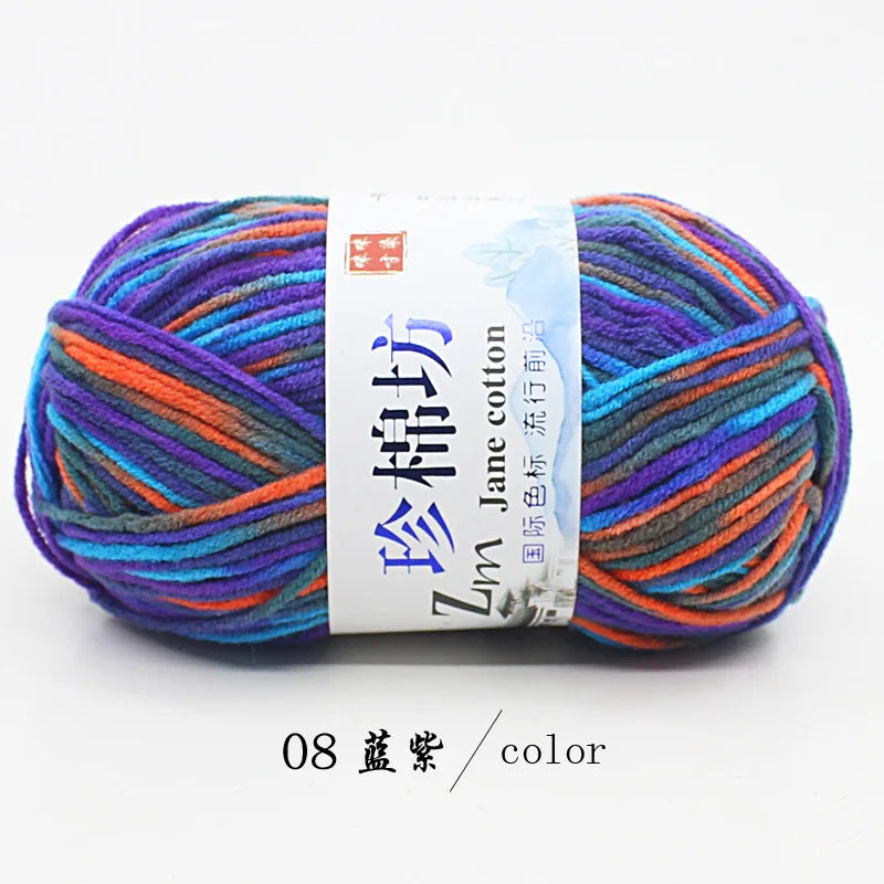 A ball of multi-colored yarn featuring shades of purple, blue, orange, and green, labeled as Jane cotton yarn.