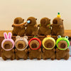 A row of adorable capybara plush toys in various colors and expressions.