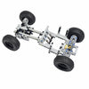 A mechanical robot built from motors and servos, featuring four wheels and a chassis.