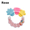 A set of silicone baby teethers in pink and yellow colors for soothing gums.