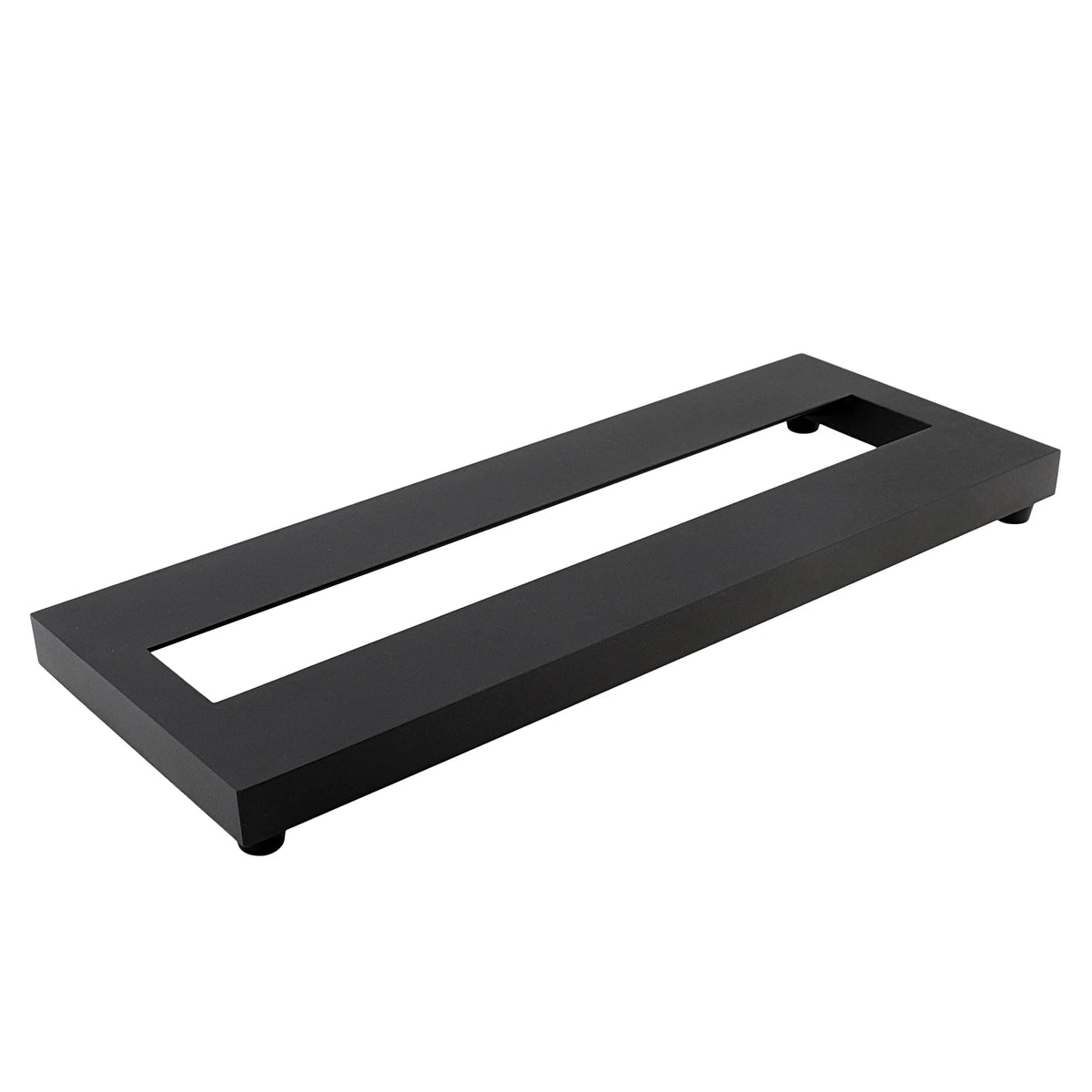 A black compact aluminum guitar pedalboard with a rectangular opening for pedals.
