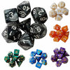 A set of seven polyhedral dice in various colors and sizes for tabletop gaming