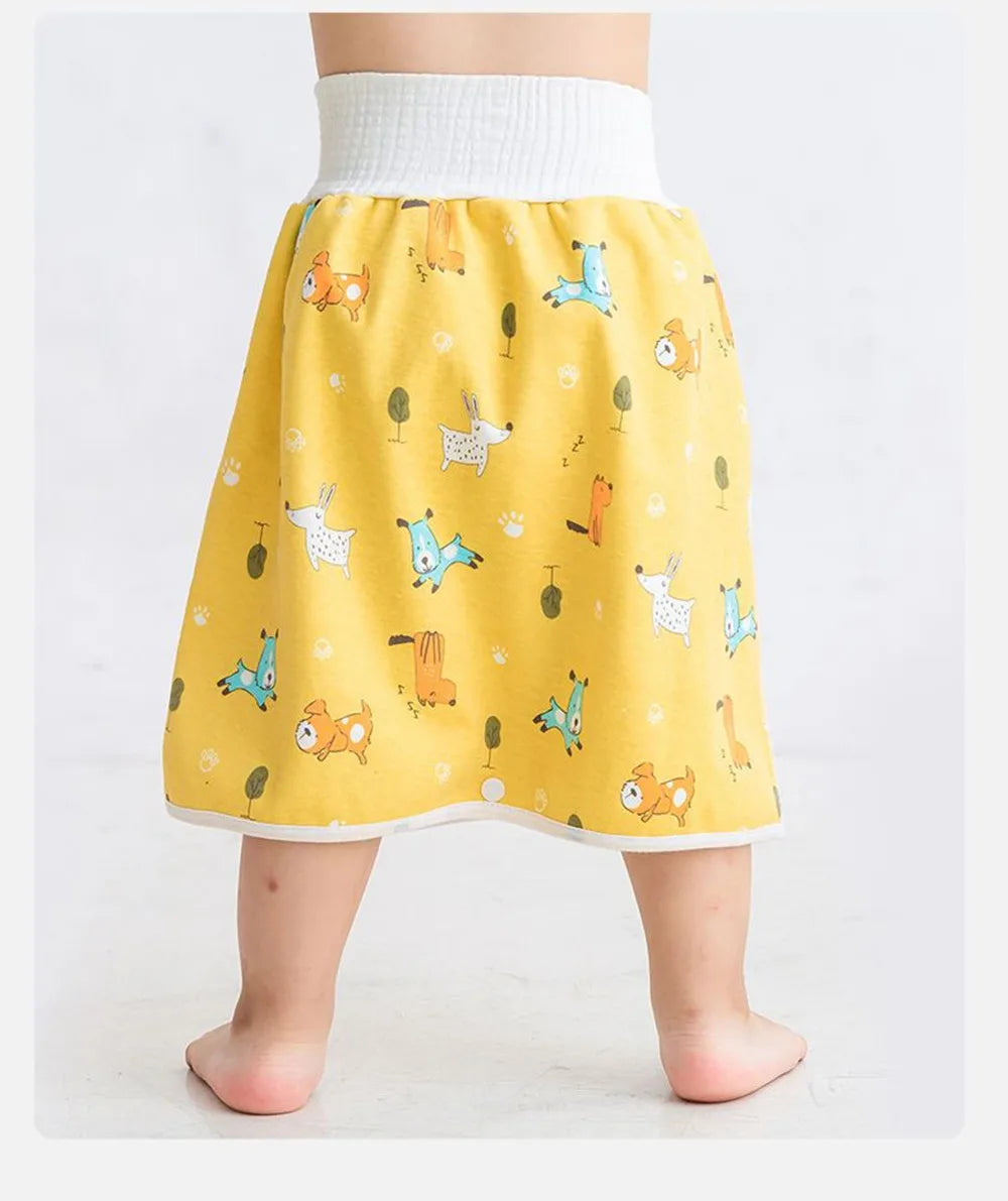 Yellow waterproof baby diaper pants with a skirt featuring animal designs for potty training
