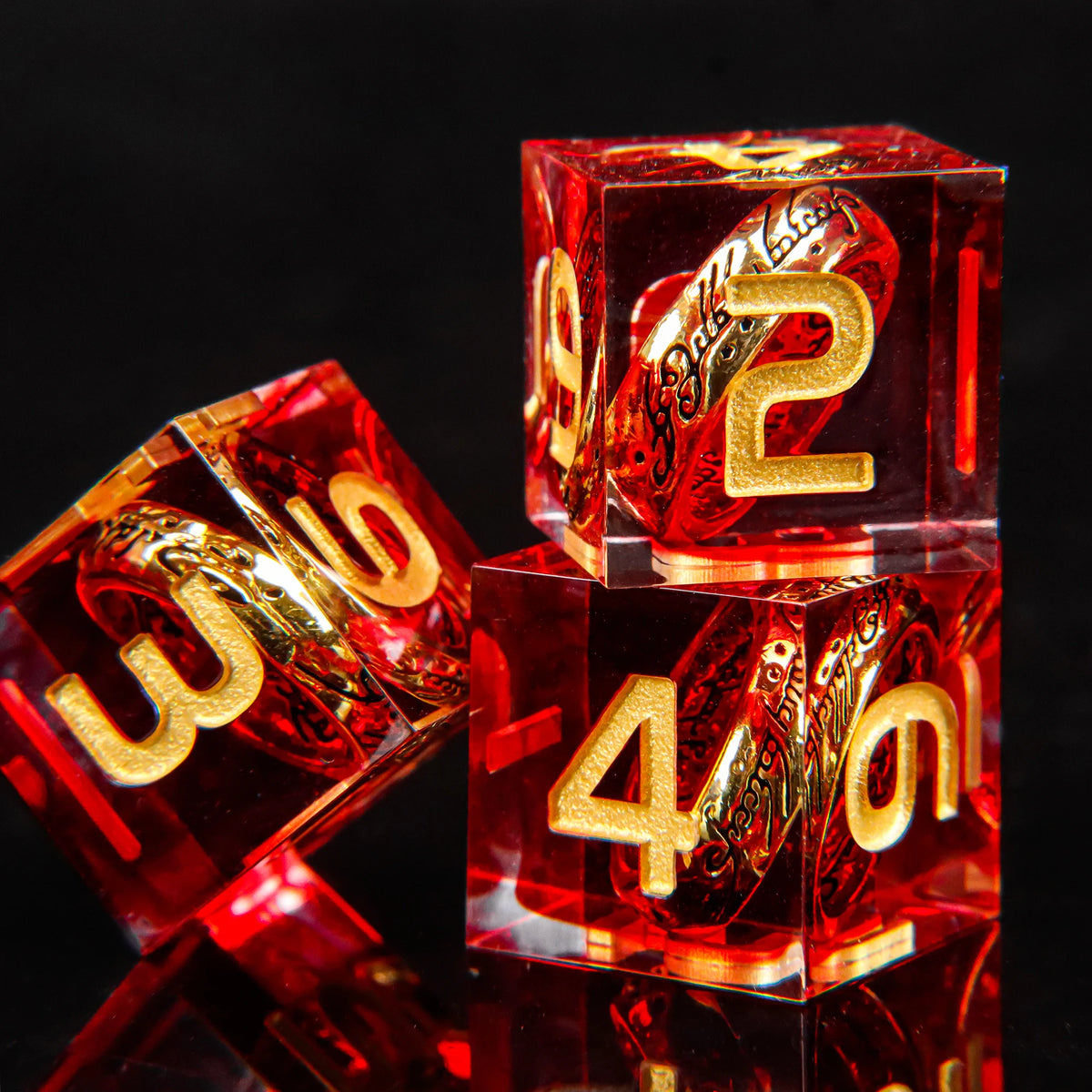 A set of red resin dice featuring golden elven numbers, including a 2 and a 4.
