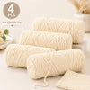 Four skeins of soft cream colored chenille yarn for crochet and knitting projects.