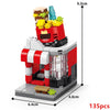 A red and white building block set depicting a mini city shop with various accessories and a display window.