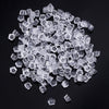 A pile of clear silicone earring backs in various stud shapes and sizes.