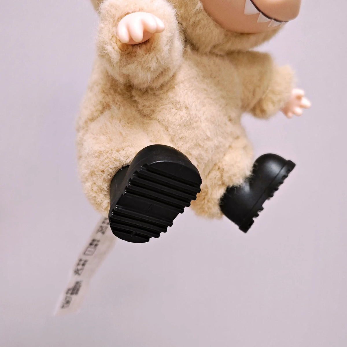 Labubu doll outfit set featuring a Mr. Black Bear hoodie and headphones.