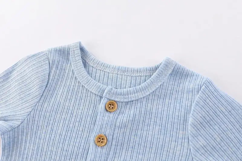 Light blue striped cotton baby bodysuit with a rounded neckline and wooden buttons