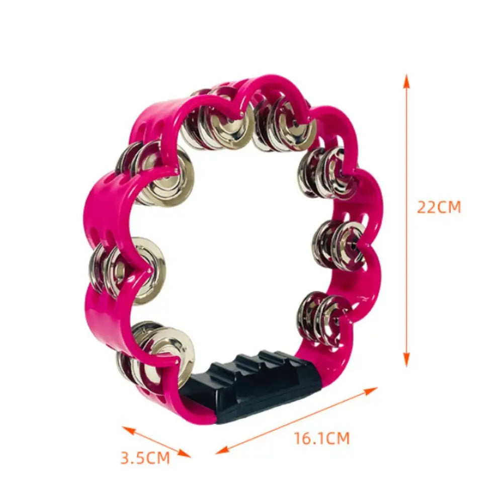 A bright pink petal-shaped hand-cranked tambourine with a silver grip shown against a white background.