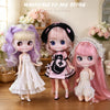 Three cute fashion dolls with purple, pink, and lavender hair standing in front of a store welcome sign.