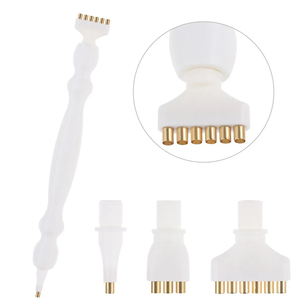 A white precision diamond painting pen with replacement tips shown in various forms.