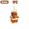 Brown capybara plush toy with yellow accents and a silver keychain ring.