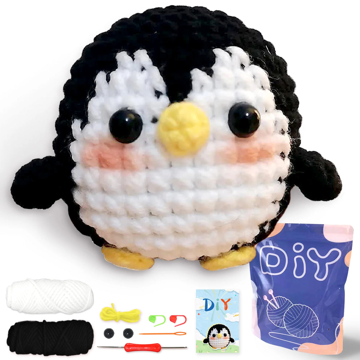 Kit de crochet débutant pour animaux amigurumi, montrant un pingouin noir et blanc fini et des fournitures en fil.