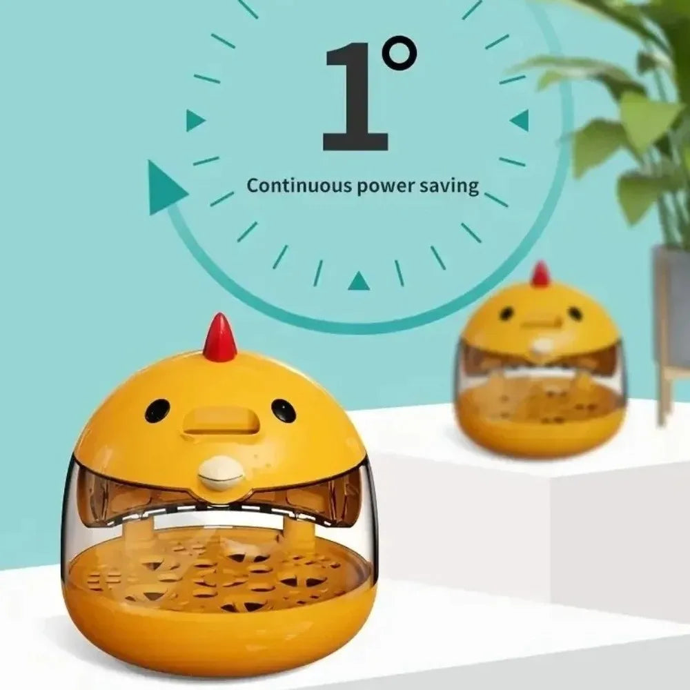 A yellow compact automatic egg incubator with a transparent window and a red top, demonstrating continuous power saving.
