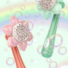 A pink and green sunflower bubble maker toy with a flower head and a tube, surrounded by iridescent bubbles.