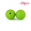 Two bright lime green silicone beads are shown against a white background.