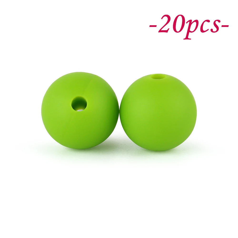 Two bright lime green silicone beads are shown against a white background.