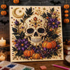 A framed piece of art featuring a skull and pumpkin design made with 3D pearls and foliage for a Halloween theme.