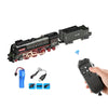 A black vintage steam train set with a remote control and spray effect is shown next to its accessories.