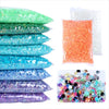 A collection of flat back resin rhinestones in various colors including green, blue, purple, and orange.