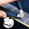A hand is using a 3-in-1 guitar string winder, cutter, and pin puller tool on a guitar fretboard.