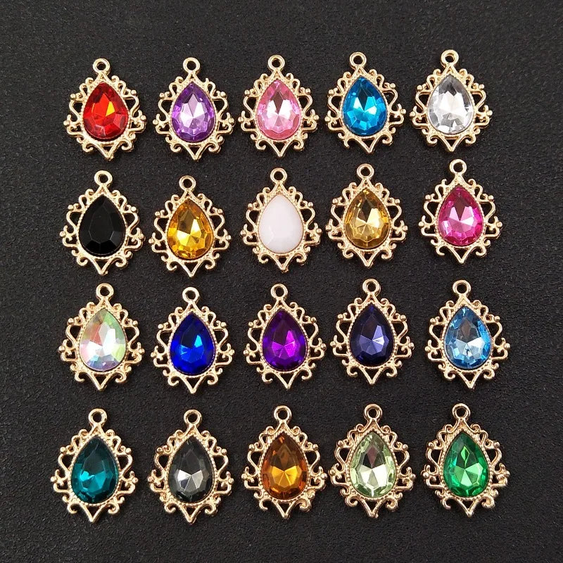 A collection of gold-plated water droplet charms featuring various colored crystal rhinestones arranged in a flower shape.