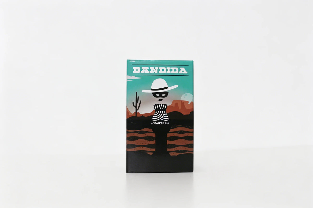 A box for the Bandida card game featuring a silhouette of a masked figure and desert landscape.