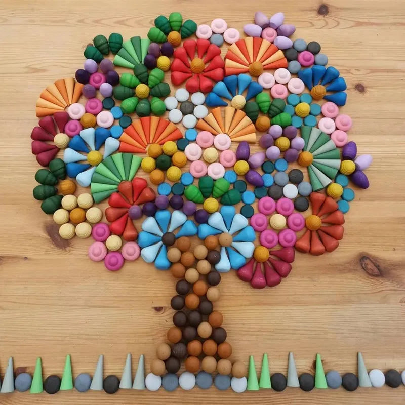 A vibrant tree made of colorful natural wooden building blocks with a rainbow theme.