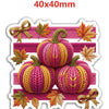 A set of ten knitted autumn pumpkins in pink and yellow yarn with gold ribbon accents.