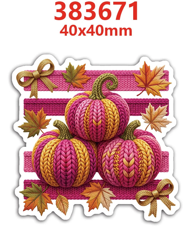A set of ten knitted autumn pumpkins in pink and yellow yarn with gold ribbon accents.