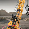 A yellow remote control spray crane truck with alloy construction is shown in a close-up view.