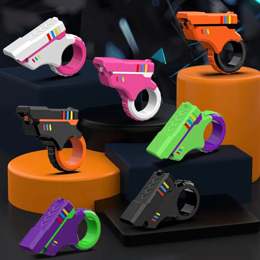 A collection of various brightly colored 3D printed rotary finger slider fidget toys displayed on a dark surface.