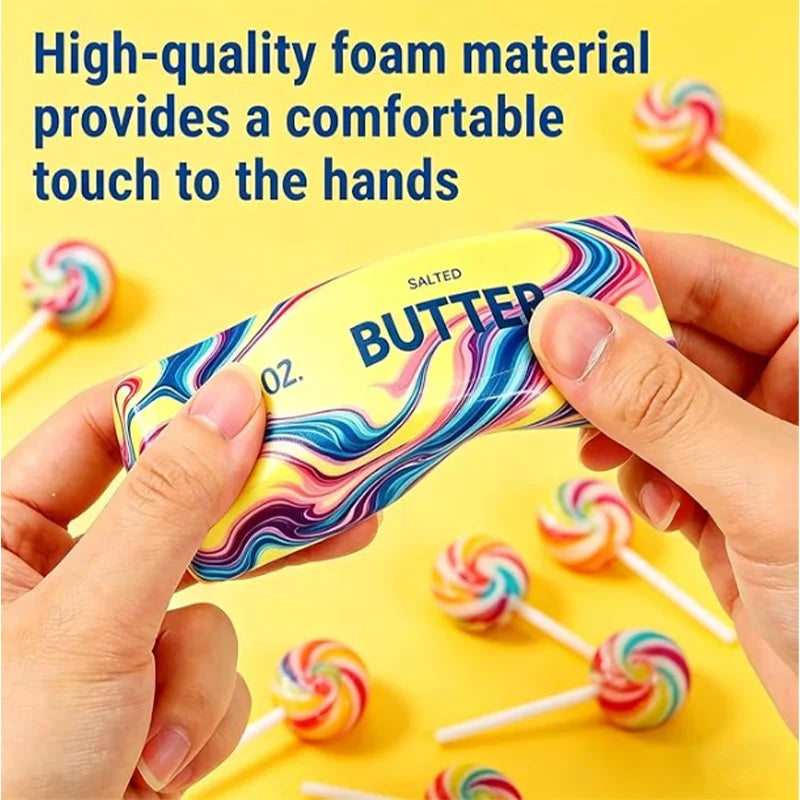 Hands hold a yellow butter squishy stress relief toy with colorful swirls on a yellow background.