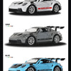 Three diecast models of the Porsche 911 GT3 RS in gray, blue, and white colors.