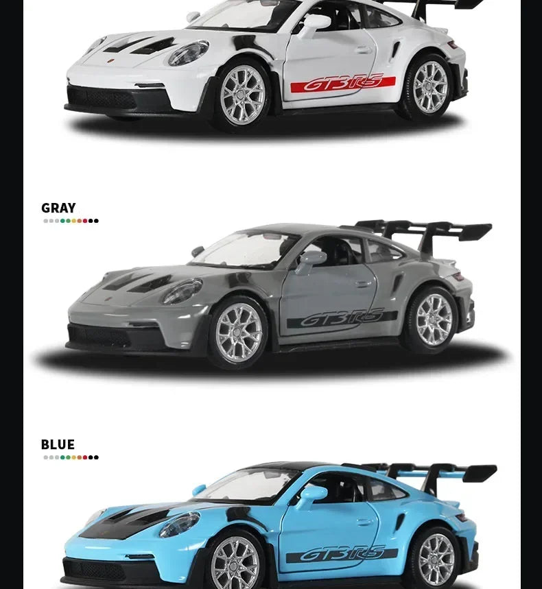 Three diecast models of the Porsche 911 GT3 RS in gray, blue, and white colors.